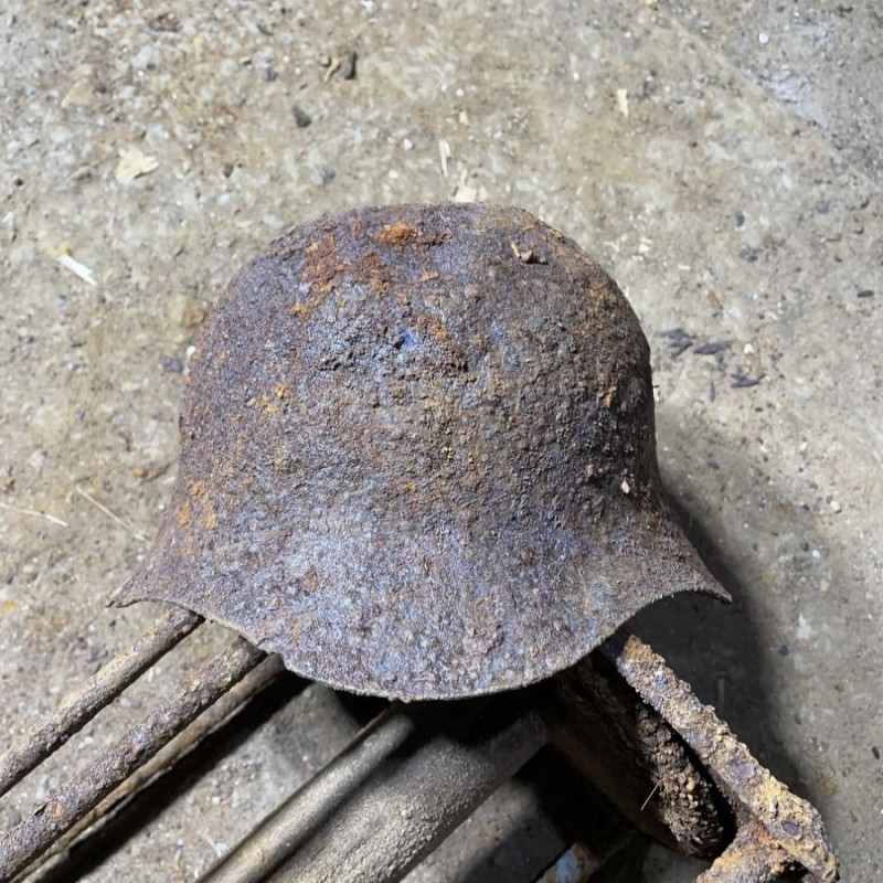 Soviet SH36 helmet with a bullet hole