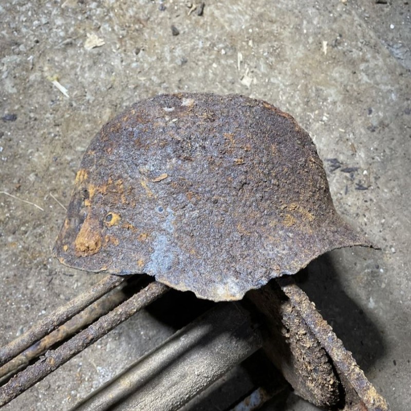 Soviet SH36 helmet with a bullet hole