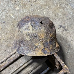 Soviet SH36 helmet with a bullet hole