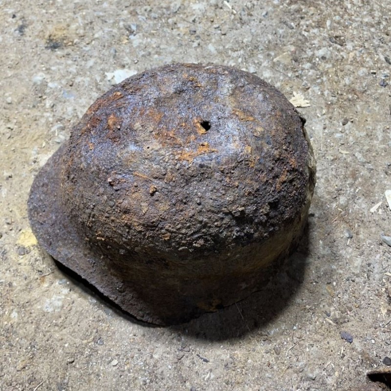 Soviet SH36 helmet with a bullet hole