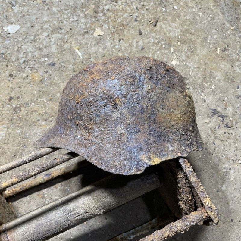 Soviet SH36 helmet with a bullet hole