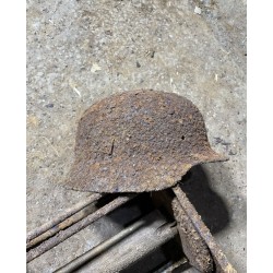 Early M35 helmet with remnants of a camouflage cover