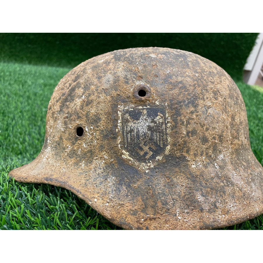 Former-winter M40 helmet with shrapnel hit