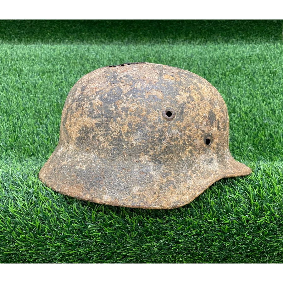 Former-winter M40 helmet with shrapnel hit